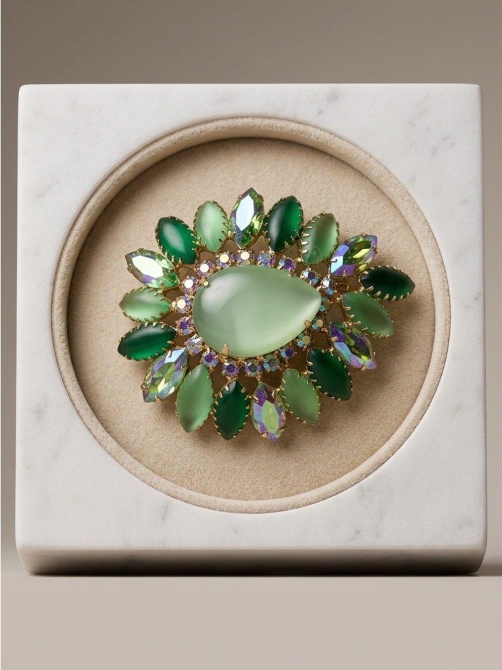 Vintage green cabochon and marquise rhinestone brooch no hallmark. Circa 1950’s